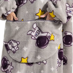 Den fluffiga hoodie-filten som kramar dig varm