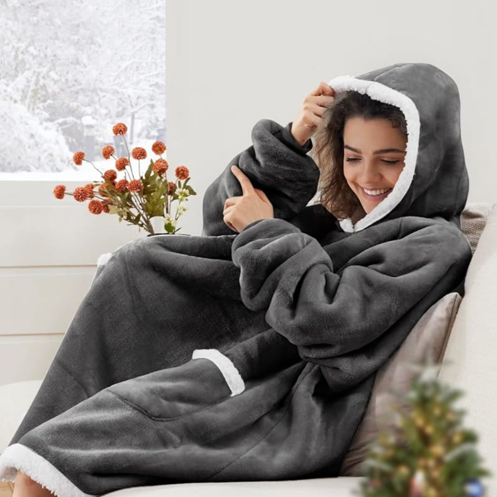 Den fluffiga hoodie-filten som kramar dig varm